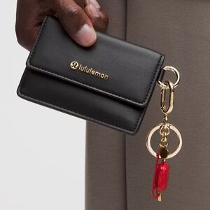 LULULEMON Leather Alternative Front Flap Card Case. NWT.